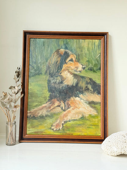 Oil painting of a dog by Muriel Hester Broughton in wooden frame, photographed on white surface.