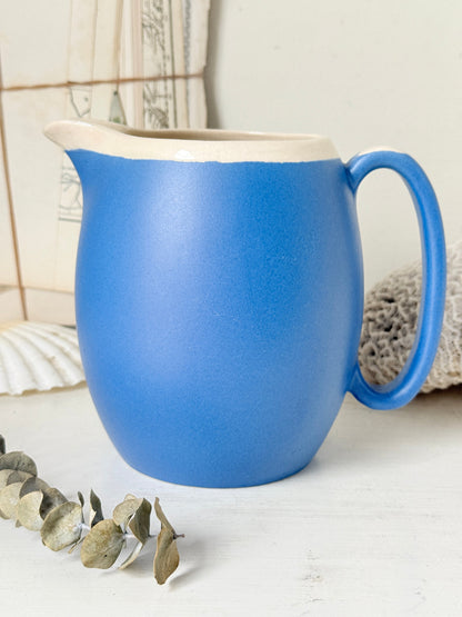 Vintage cornflower blue glazed stoneware jug with cream interior, pulled spout and curved handle for kitchen styling