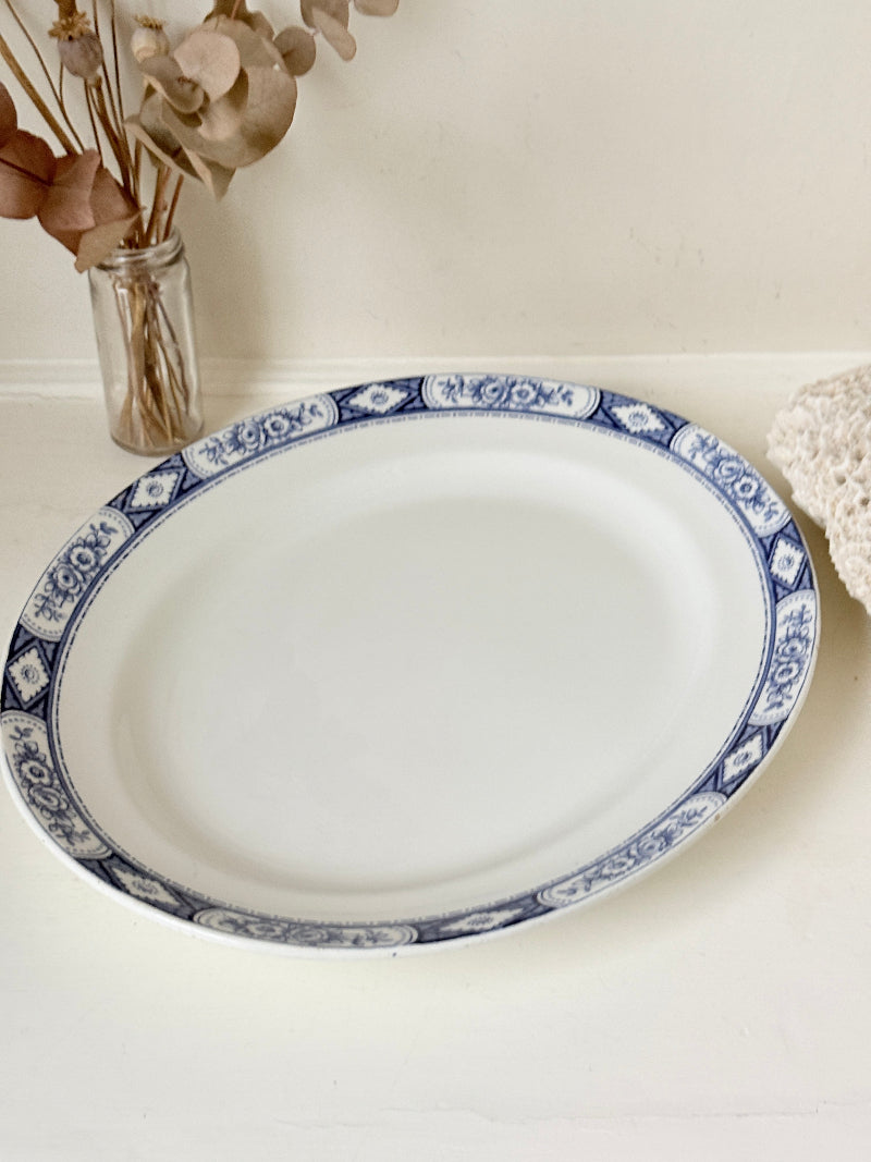Vintage Burleigh Ware blue and white oval serving platter photographed on a white surface