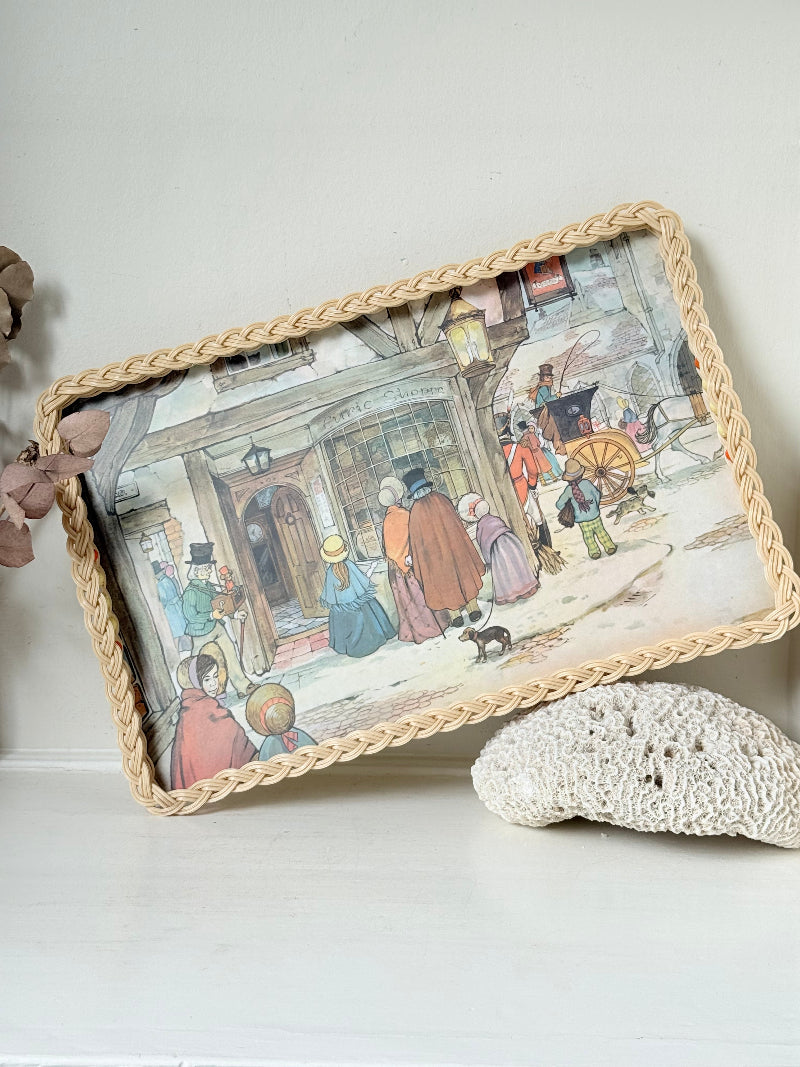 Vintage melamine tray with wicker effect edge and Victorian street scene, photographed on a white surface