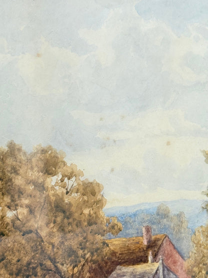 Antique watercolour landscape in gilt frame, countryside scene with trees, photographed on white surface.