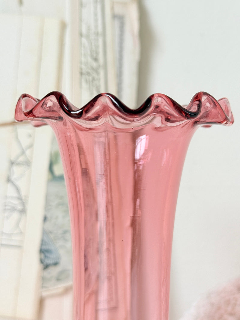 Pair of cranberry glass vases with crimped frill rims, trumpet vase and bulbous bud vase in soft pink glass