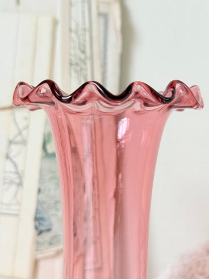 Pair of cranberry glass vases with crimped frill rims, trumpet vase and bulbous bud vase in soft pink glass