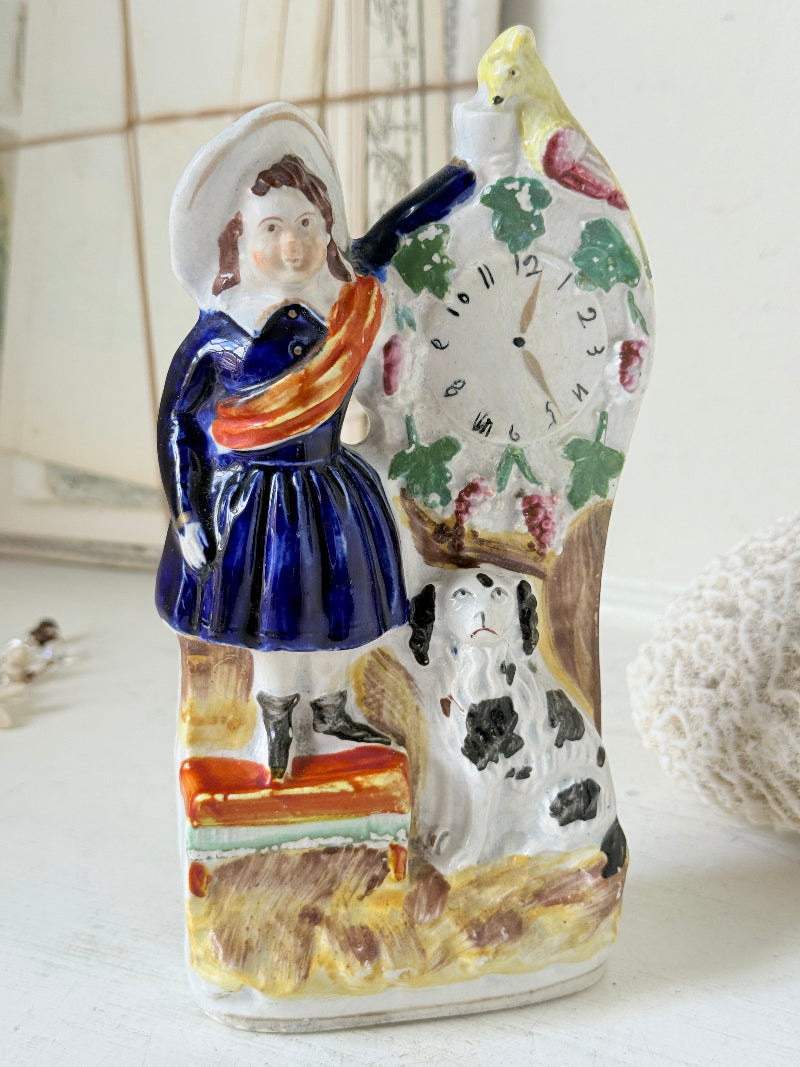 Victorian Staffordshire flatback clock group with girl spaniel and parrot hand painted in cobalt blue and orange