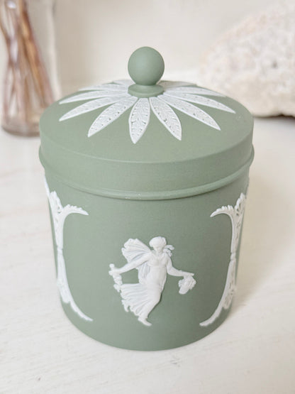 Vintage Wedgwood Jasperware sage green lidded jar with ball finial, decorated with white Dancing Hours neoclassical figures, styled with dried stems.