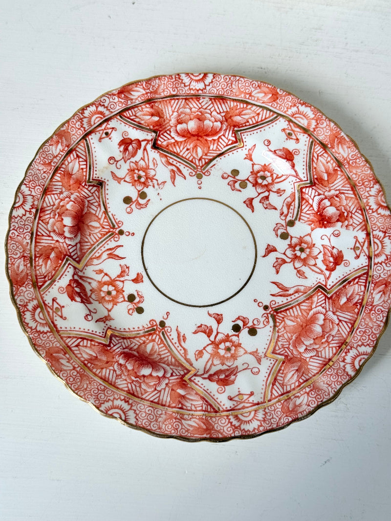 Set of 12 vintage coral transferware porcelain plates with scalloped edges and gold accents, 15 cm diameter, styled on a white surface.