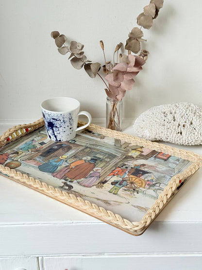 Vintage melamine tray with wicker effect edge and Victorian street scene, photographed on a white surface