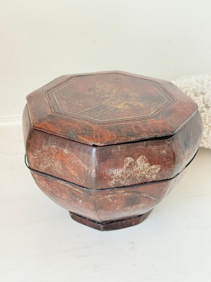 Antique octagonal Chinese lacquer basket with floral decoration and central figure, shown with lid on and off on a white surface


