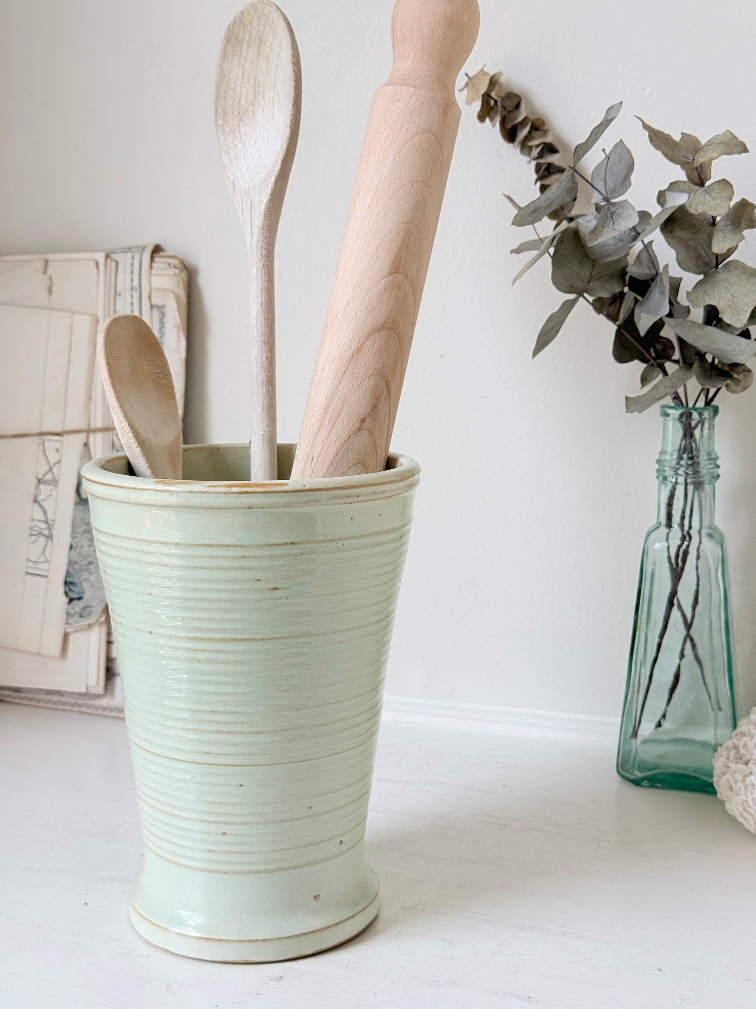 1960s Burton Ware ribbed stoneware pot in sage green, photographed on a white surface