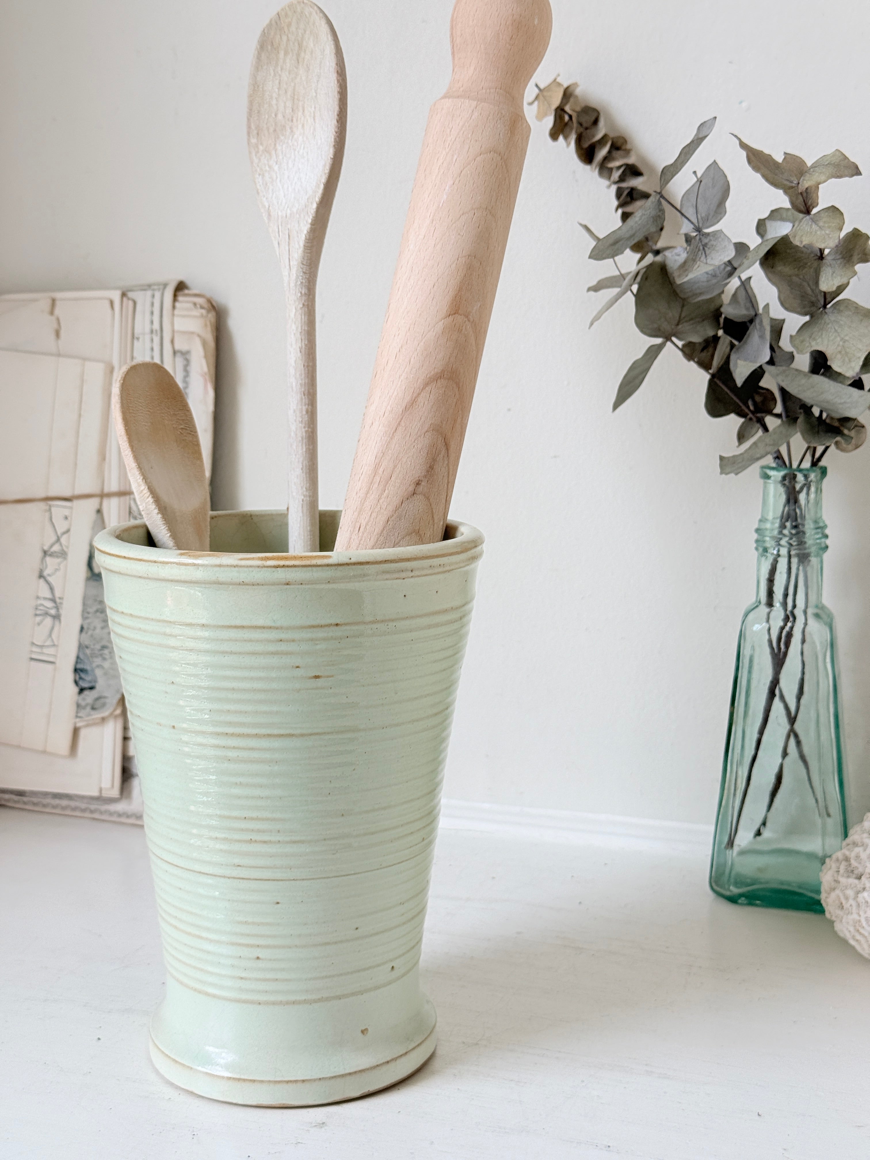 1960s Burton Ware ribbed stoneware pot in sage green, photographed on a white surface