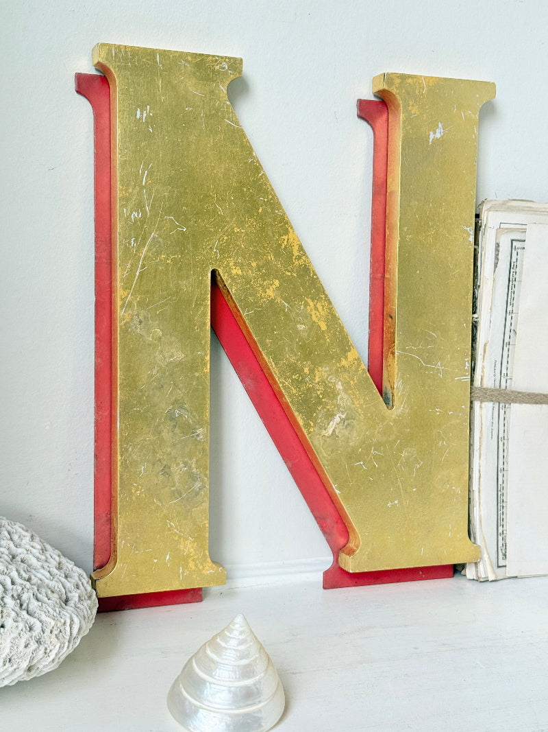 Vintage Shop Sign Letter N in Gold and Red with Serif Detail