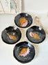 Set of 4 vintage Henriot Quimper faience plates with hand painted shell motifs, scalloped edges and black ground decoration