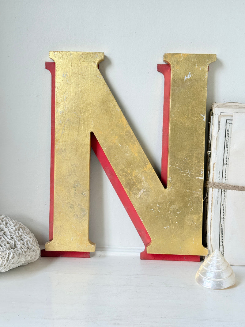 Vintage Shop Sign Letter N in Gold and Red with Serif Detail