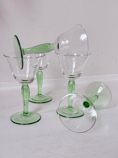 Set of five green stemmed liqueur glasses