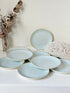 Set of 8 Churchill speckled duck egg side plates with warm rim photographed on a white surface