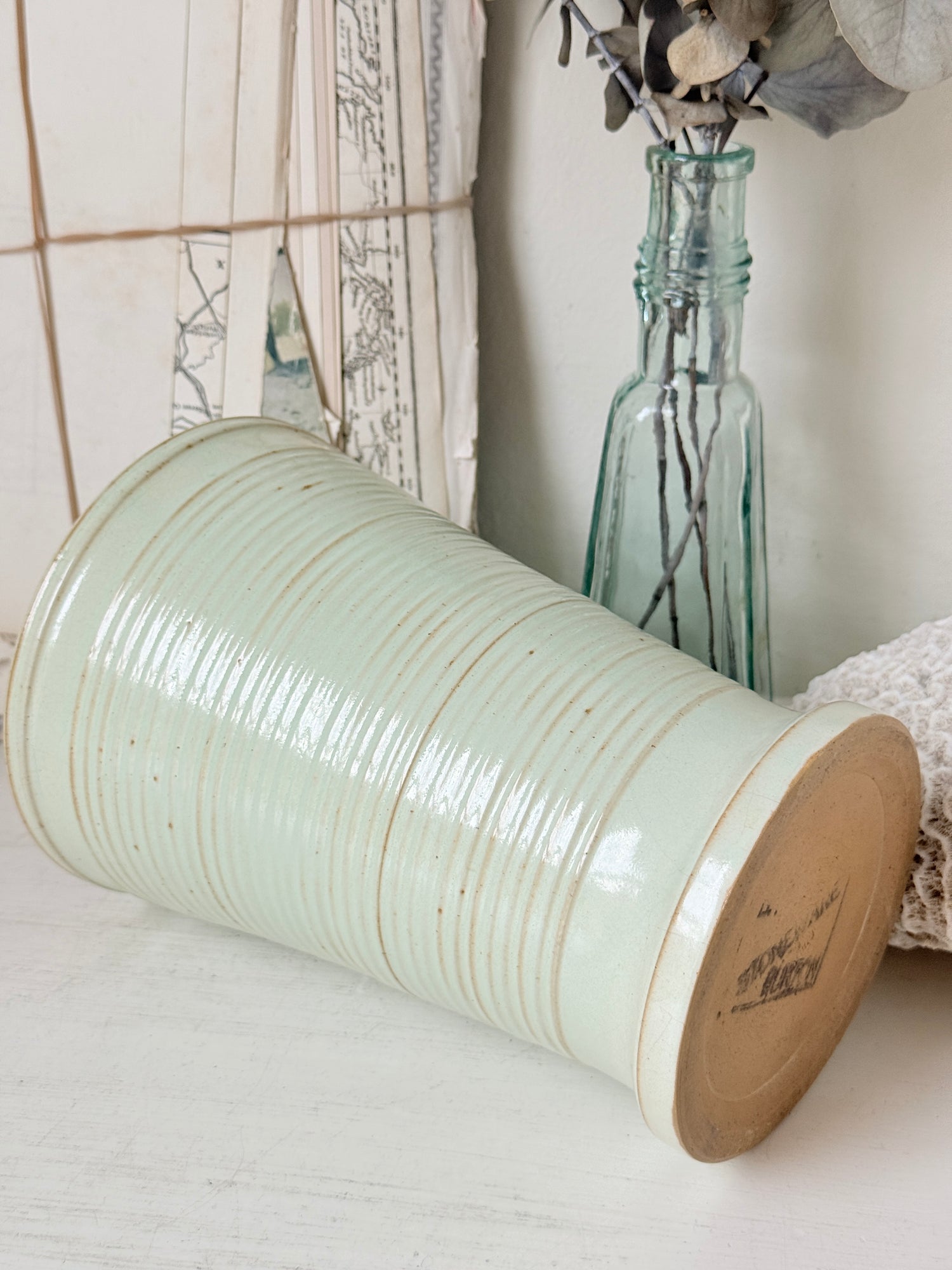 1960s Burton Ware ribbed stoneware pot in sage green, photographed on a white surface