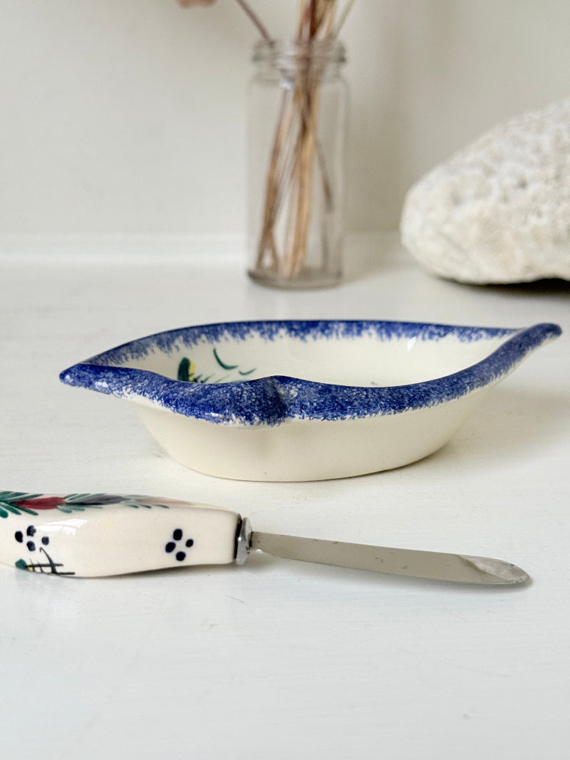 Vintage Quimper butter dish with ceramic knife, hand painted Breton figure, photographed on a white surface