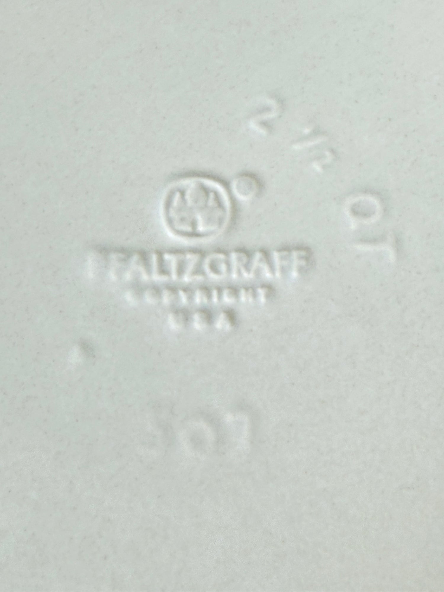 Pfaltzgraff Yorktowne stoneware sugar jar with blue floral motif and lid, photographed on a white surface