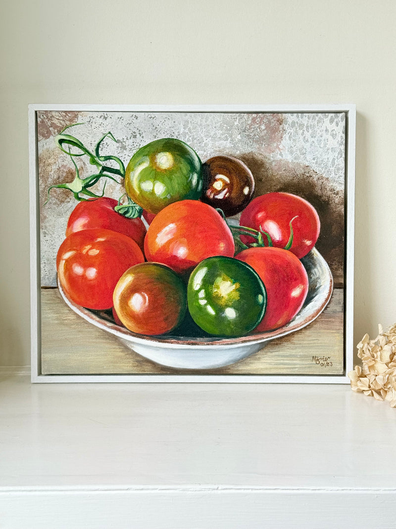 Original still life painting of tomatoes by M. Brier, 2021, framed in white box frame and photographed on white surface

