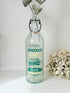 vintage french soda bottle phenix aqua green glass with ceramic swing top 31cm on white surface