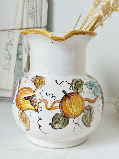 Vintage Deruta Italian hand painted maiolica jug with fruit and vine motif, yellow rim and Mediterranean ceramic styling