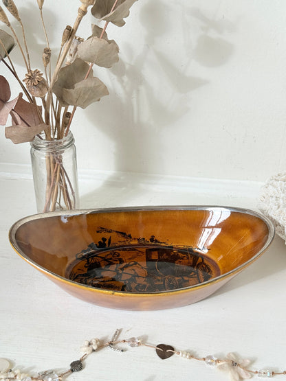 Antique Ridgways stoneware oval dish photographed on a white surface in amber treacle glaze with black Coaching Days and Coaching Ways transfer scene