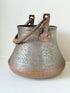 antique Middle Eastern water ewer with engraved diamond and foliate pattern and copper base, displayed on white surface