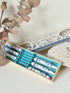 Set of 6 vintage Blue Willow fondue forks with coloured ends in original box, photographed on a white surface