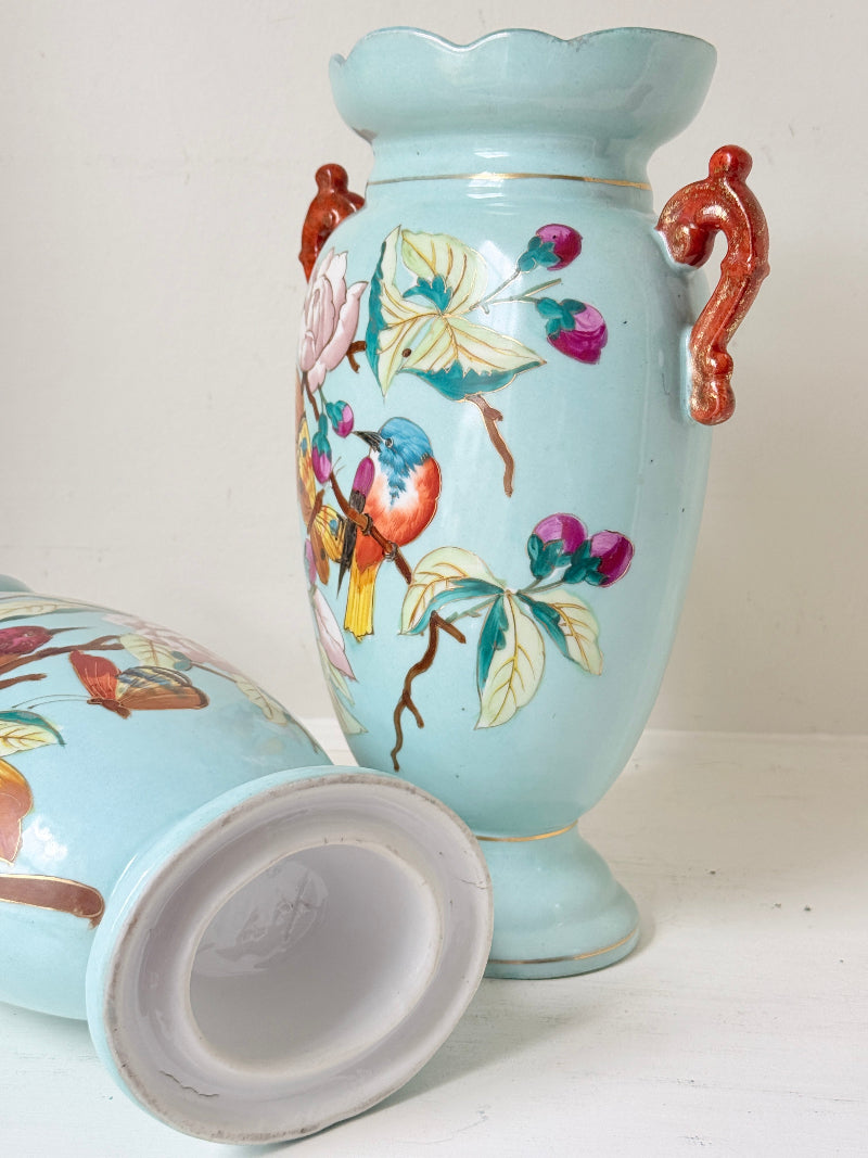 Pair of Paris porcelain Aesthetic Movement vases from the late 1800s, hand painted with birds, blossom and coral handles