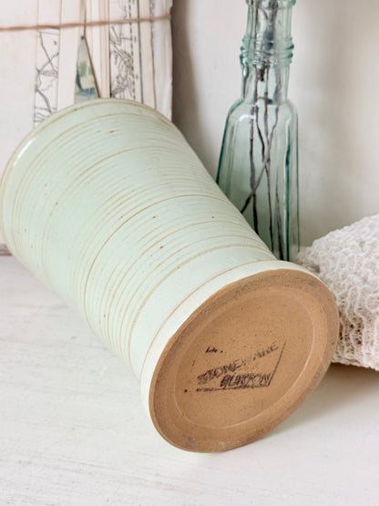 1960s Burton Ware ribbed stoneware pot in sage green, photographed on a white surface