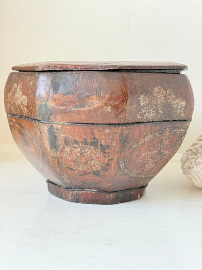 Antique octagonal Chinese lacquer basket with floral decoration and central figure, shown with lid on and off on a white surface

