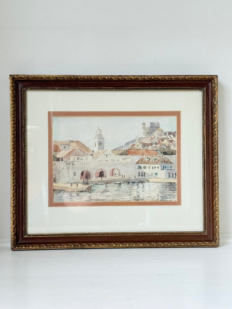 Framed watercolour painting of Dubrovnik harbour and old town architecture, photographed on a white surface