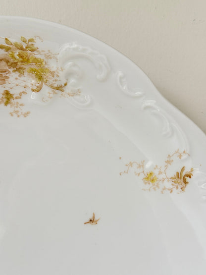 Antique Springer and Co Elbogen Senta porcelain platter in white with floral detail, photographed on a white surface