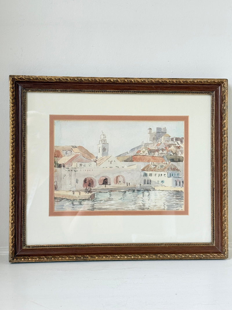 Framed watercolour painting of Dubrovnik harbour and old town architecture, photographed on a white surface
