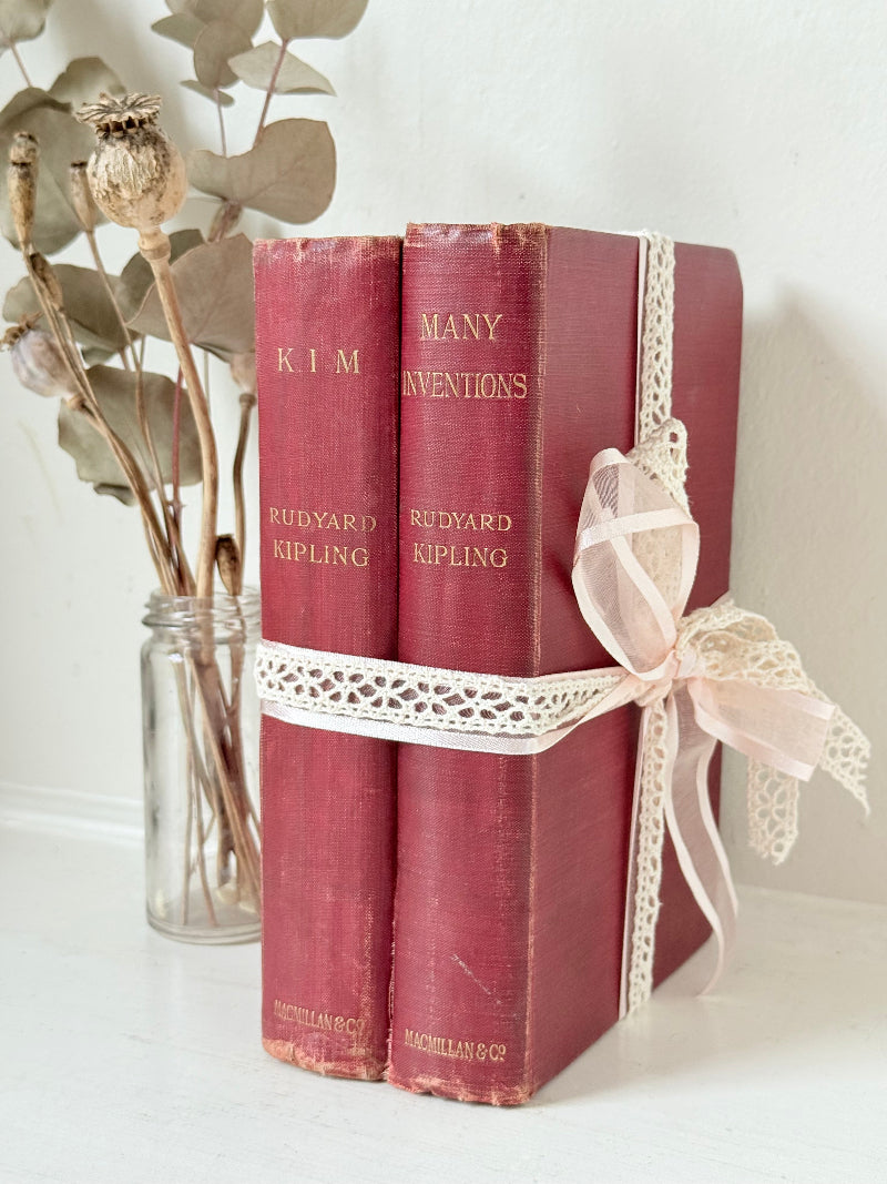 Vintage Rudyard Kipling book bundle of Kim and Many Inventions in red hardback covers, photographed on a white surface
