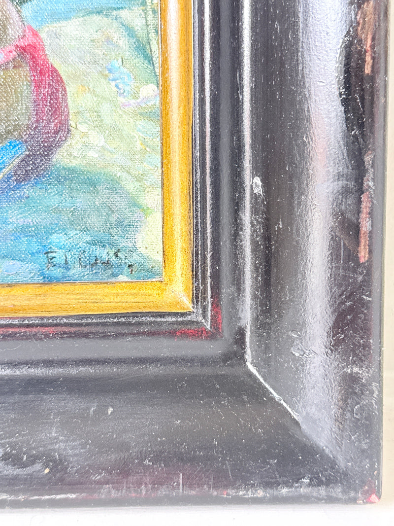 Close-up detail of a framed painting corner, showing a black frame with gold inner trim and a colorful painted section in blue, green, and red.