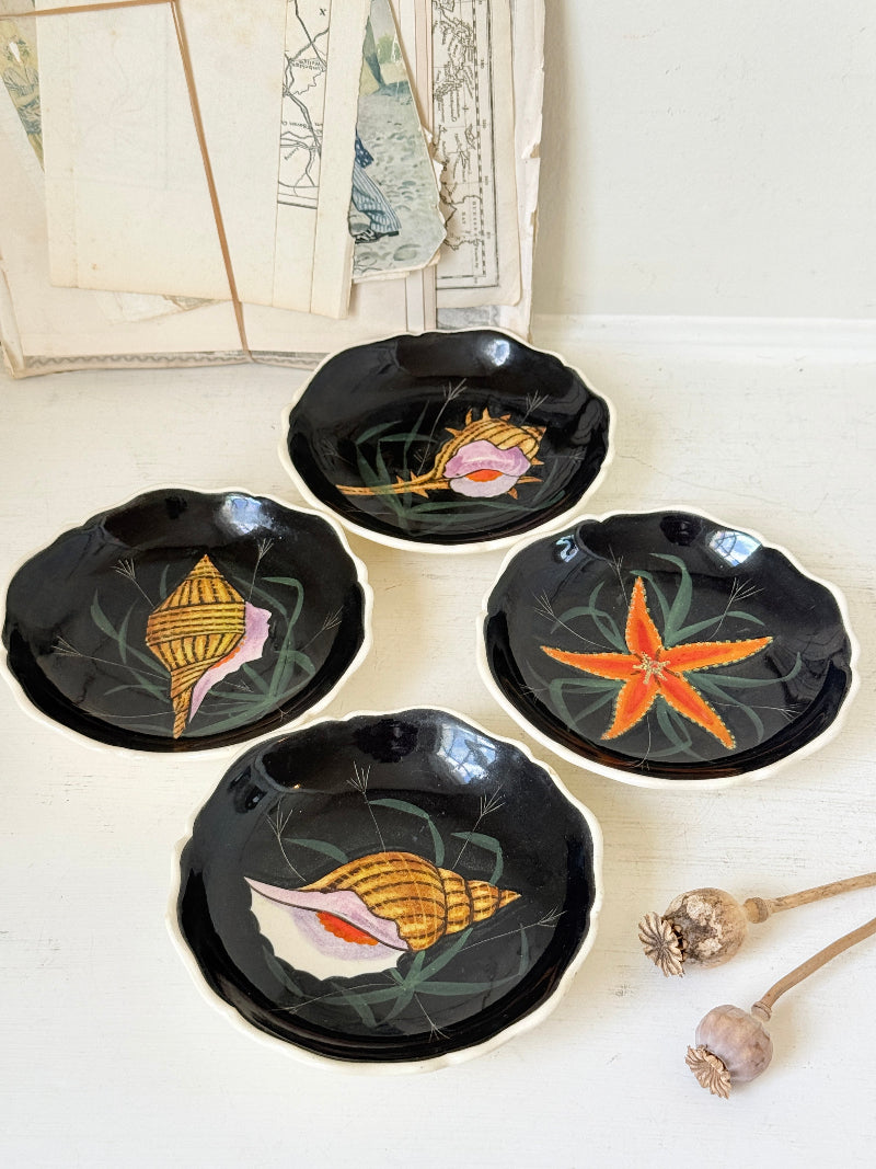 Set of 4 vintage Henriot Quimper faience plates with hand painted shells, starfish, seaweed and black ground decoration