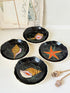 Set of 4 vintage Henriot Quimper faience plates with hand painted shells, starfish, seaweed and black ground decoration