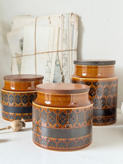 Hornsea Heirloom coffee tea and sugar canister set in autumn brown stoneware with teak lids photographed on a white surface