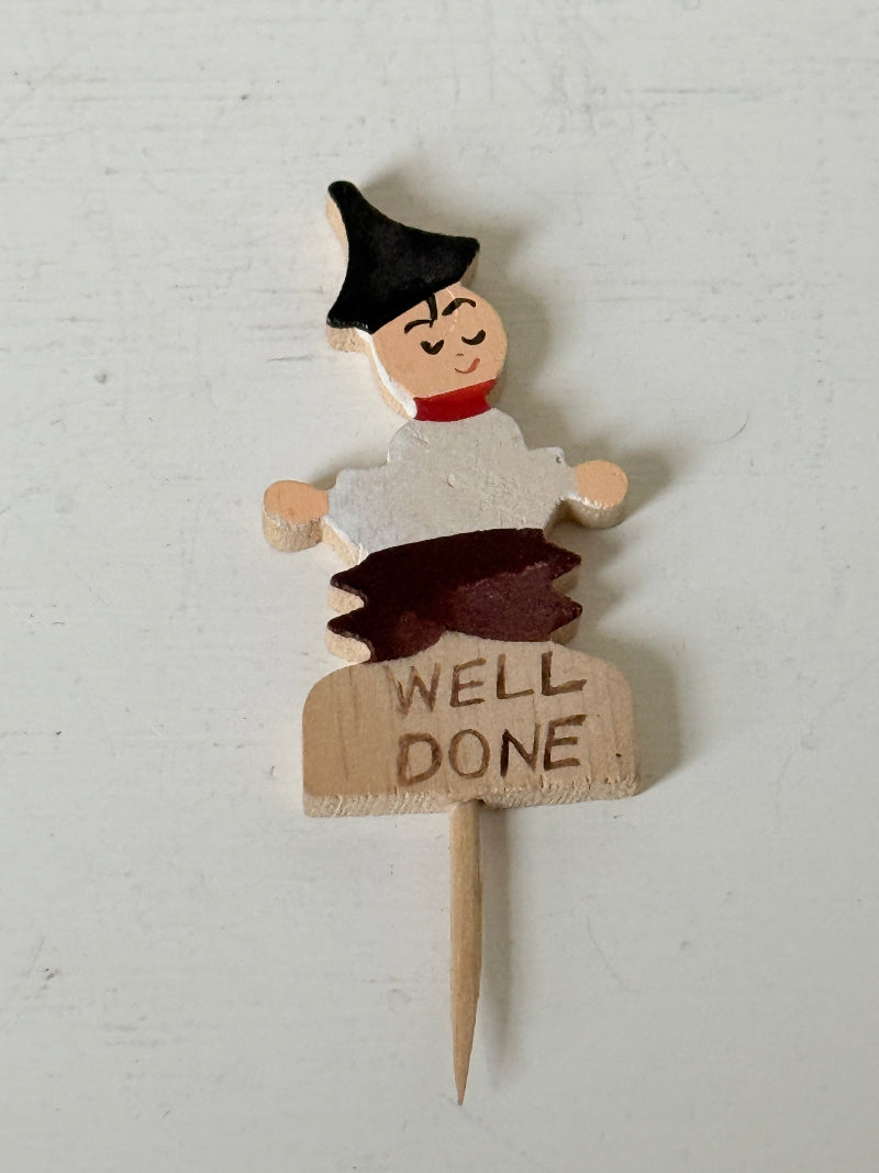 Vintage hand painted wooden steak markers on cocktail sticks labelled rare medium and well done, photographed on a white surface