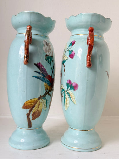 Pair of Paris porcelain Aesthetic Movement vases from the late 1800s, hand painted with birds, blossom and coral handles