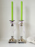 Pair of Hollywood Regency silver plate and Perspex Lucite candlesticks on bun feet with green taper candles