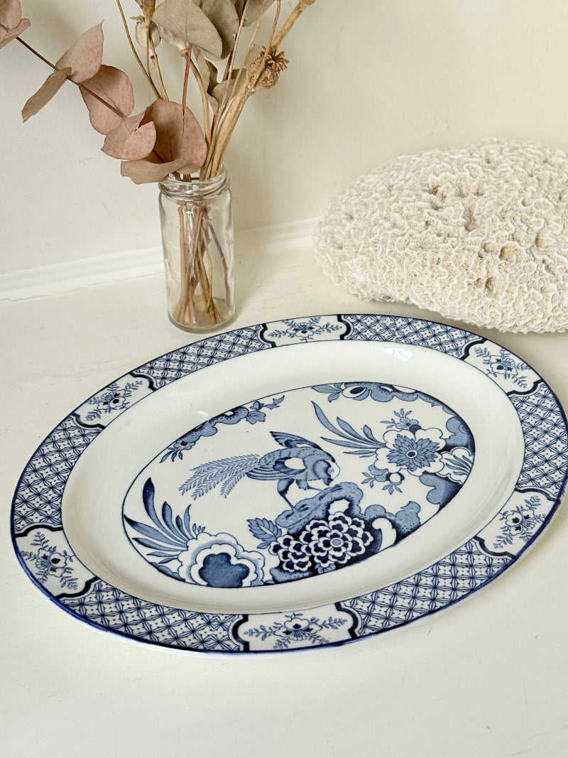 Vintage Woods and Sons Yuan blue and white serving platter photographed on a white surface
