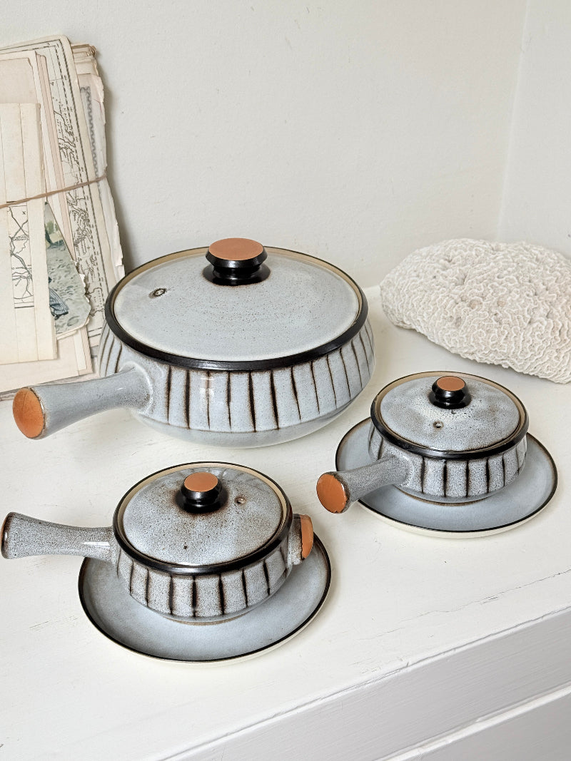 Denby Studio stoneware casserole and soup bowl set in grey and rust photographed on a white surface