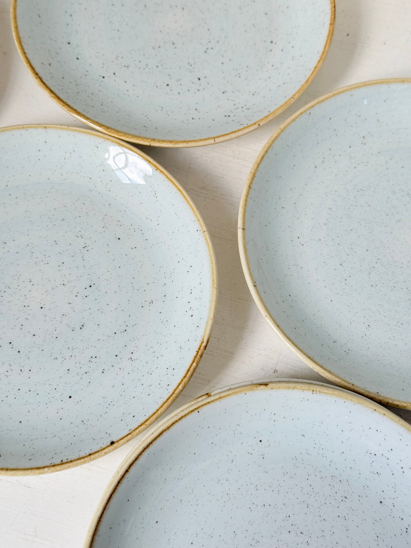 Set of 8 Churchill speckled duck egg side plates with warm rim photographed on a white surface