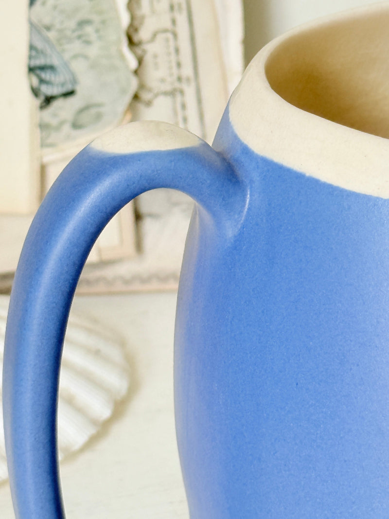 Vintage cornflower blue glazed stoneware jug with cream interior, pulled spout and curved handle for kitchen styling