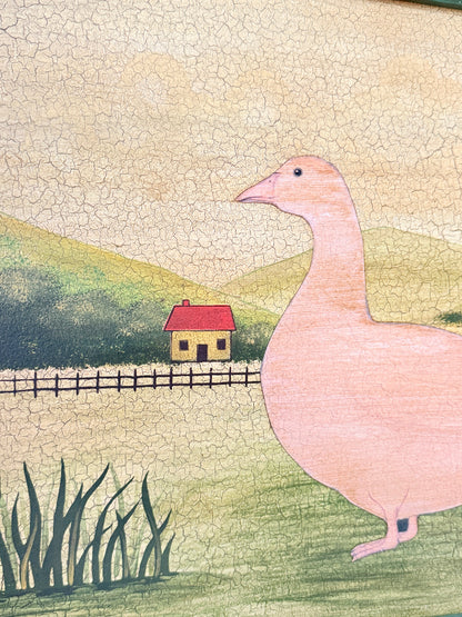 A hand-drawn style illustration of a large pink goose standing in a grassy field, with a small red-roofed house, fence, hills, and cracked beige sky in the background.