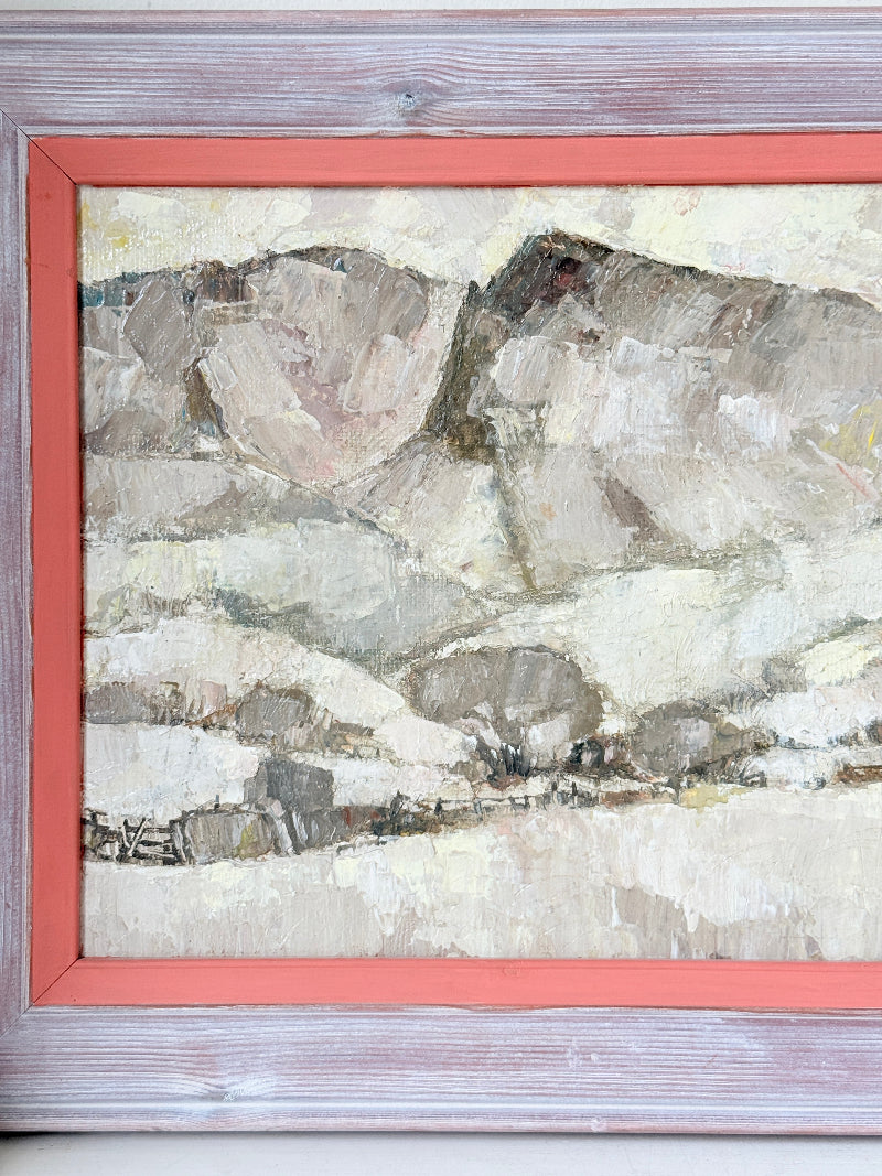 A framed landscape painting featuring textured brushstrokes of gray, beige, and white tones, bordered by a coral-red mat and a rustic weathered gray wooden frame.