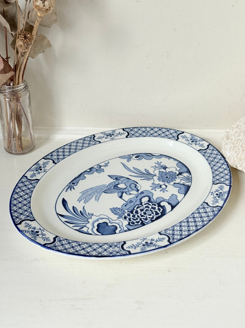 Vintage Woods and Sons Yuan blue and white serving platter photographed on a white surface