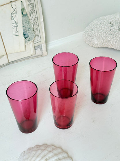 Set of 4 vintage cranberry glass tumblers in tall beaker form with deep pink colour and one slightly paler glass